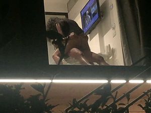 Voyeur caught horny couple fucking through hotel window 
